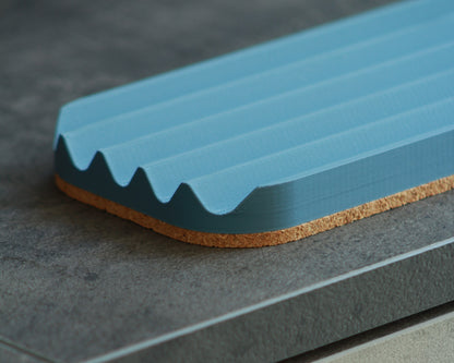Wavy pen tray