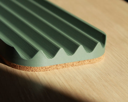 Wavy pen tray
