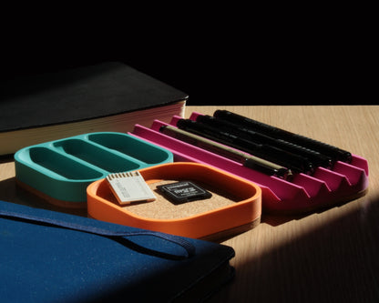 Colorful desk organizers on a wooden surface with a dark background